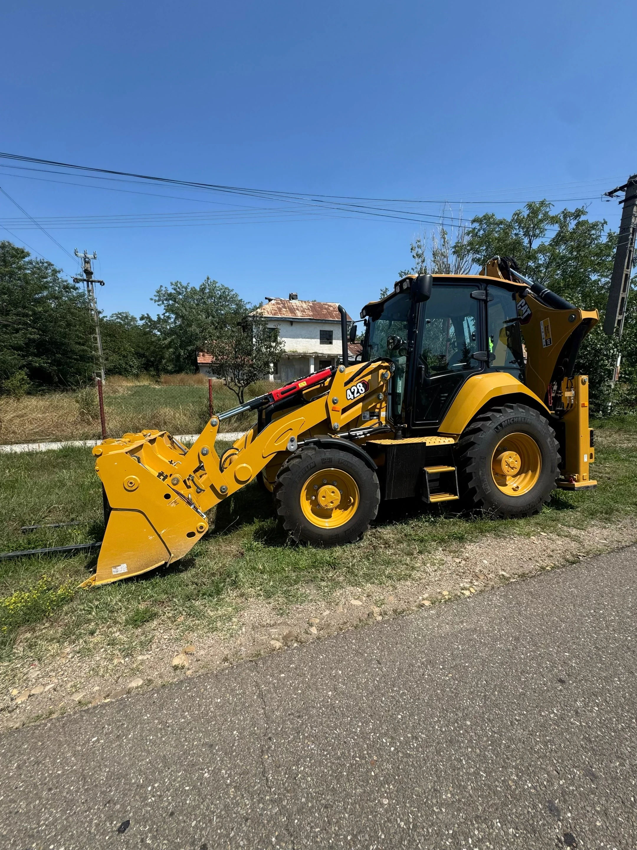 Excavation and mechanized earthworks with backhoe loader